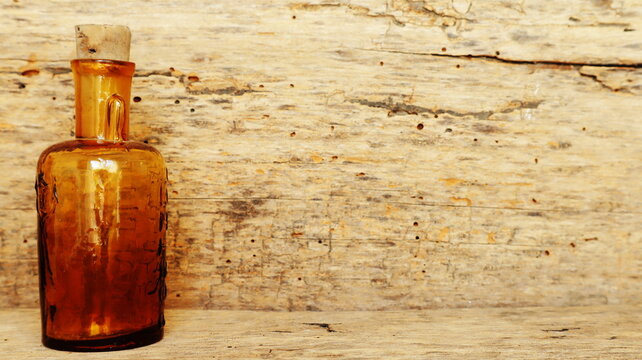 Antique Medicine Bottle, Victorian Era, on a original 1800s wooden background with space for your text or design