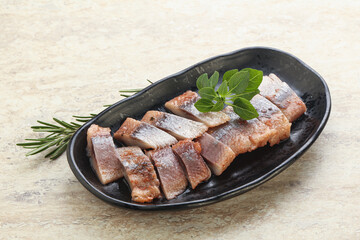 Delicous sliced herring fillet in grape sauce