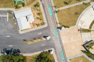 Aerial view top down of car parking lot with white line of traffic sign on the street. Above view of car in a row at parking space Outside car parking area