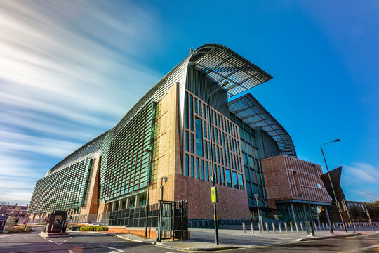 The Francis Crick Building Near Kings Cross, London, As A Long Exposure With Streaky White Clouds In A Blue Sky Above.