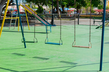 Playground in the park. Swings.