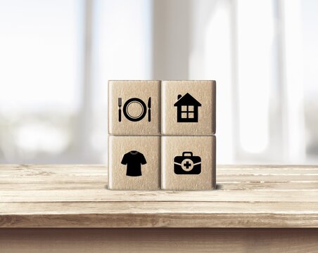 The investor's concept, wooden cube with concept work from home, Planning to buy property concept ,food Clothing, housing, medicine, four basic human needs concept.