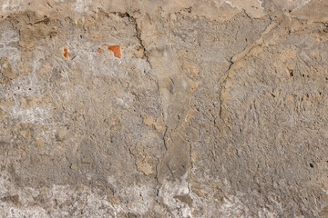 Broken old concrete wall surface with cracks for texture background