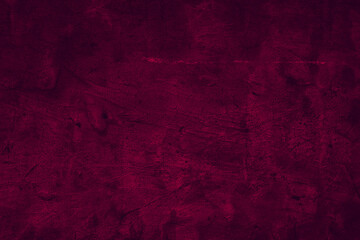 Seamless grunge textured classic dark magenta color concrete wall surface for background
