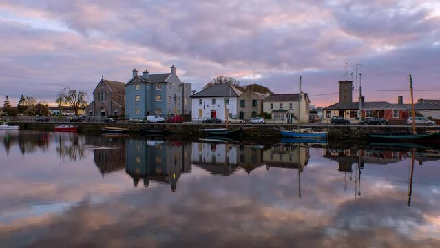 Galway, Ireland. Beautiful landscape of Galway, Ireland. River and famous painted houses with cloudy colorful sky. Time-lapse during the sunset