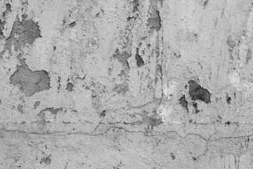 Abandoned rustic concrete wall with cracks for texture