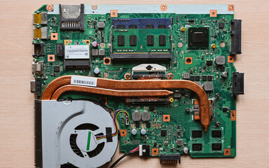 laptop motherboard close-up, laptop cooling system, copper cooling tubes, top view