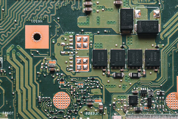 disassembled laptop. repair and maintenance of laptops. removing dust with a brush. hands in the...