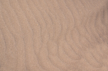 Fototapeta na wymiar Beach sand background with ripples