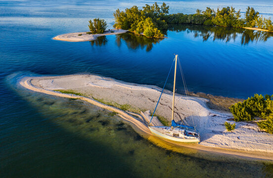 Aerial view of a sailboat docked along the shoreline at Indian River, Sebastian Oaks, Florida, United States.