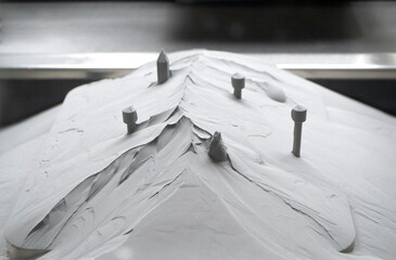 Surface with printed objects on metal 3D printer, covered metal powder inside of metal 3D printer....