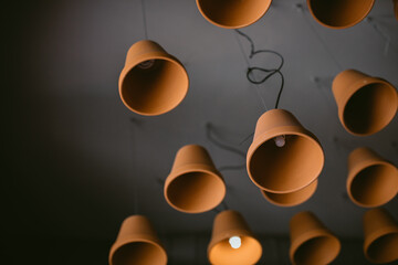 Ceiling lamps with decorative lampshades made of ceramic pots. Lighting design ideas.