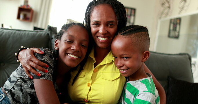 African Mother Embracing Teen Daughter And Little Boy Son. African Black Ethnicity, Love And Affection