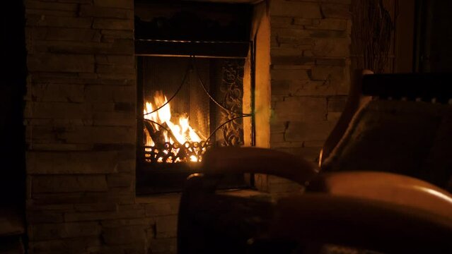 Portrait of the fireplace burning in a cozy room