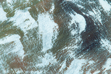 abstract colorful creative background - rough linen canvas unevenly covered with multi-colored primers, reflections of light. Toning, blur. Temporary object.