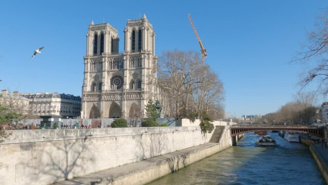 Notre Dame de Paris. Cathedral of notre dame de paris over the Seine. Bateau mouche. Blue sky, beautiful day