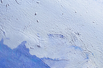 abstract creative background: oil paint frozen in a container after dilution, light color toning, short focus.