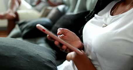 African mixed race girl holding smartphone device