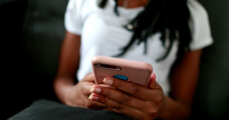 African mixed race girl holding smartphone device