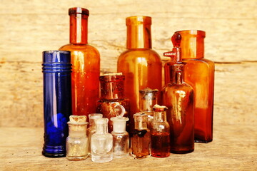 Antique Medicine Bottles, Victorian Era, on a original 1800s wooden background