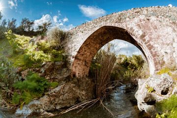 Fototapeta na wymiar Medieval venetian stone bridge in Akapnou. Limassol District, Cyprus