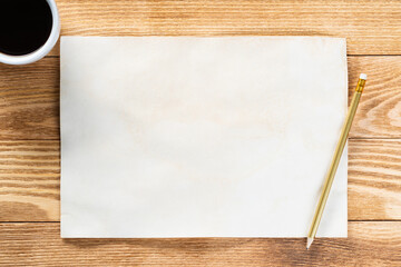 Sheet of paper lying on wooden table