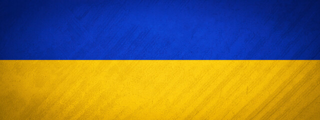 Ukrainian flag background banner panorama - Old rustic damaged concrete stone wall texture background, painted in the colors of the flag of Ukraine