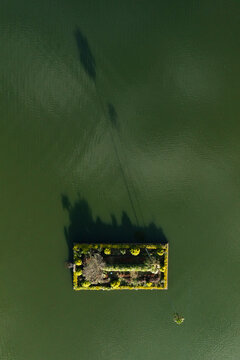 Aerial top down view of the Seema Malakaya, Sri Dalada Maligawa Buddhist temple in the island in Kandy lake, Kandy, Sri Lanka.