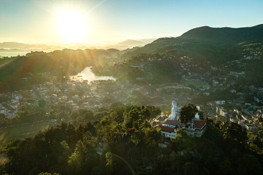 Aerial view of sunrise over Kandy city and Bahirawakanda Vihara Buddha Statue, Sri Lanka.