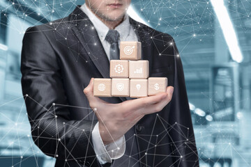 Businessman shows movement algorithm while planning goals in business.