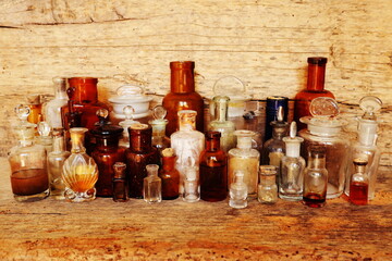 Antique Medicine Bottles, Victorian Era, on a original 1800s wooden background