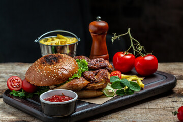 Hamburger with chicken, tomatoes, pickled cucumber. atty burger with fries and dips meal. banner, menu, recipe place for text