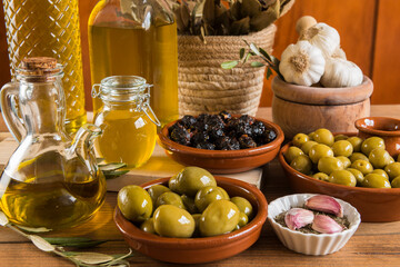 Still life with olives and extra virgin olive oil.