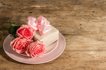 Romantic dinner table on rustic background. Love cutlery for Valentine's or Mother's day, Wedding