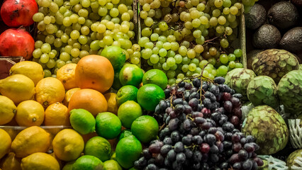 Naklejka na ściany i meble a counter full of fresh fruit exposed the local market