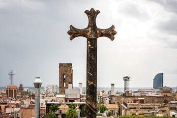 a cross on the terrace of the cathedral of barcelona has a spectacular view over the city