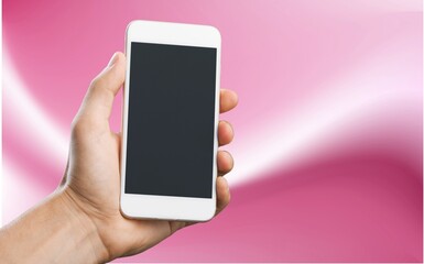 Hand holds phone Sample social media app interface on mobile phone showing shared video content