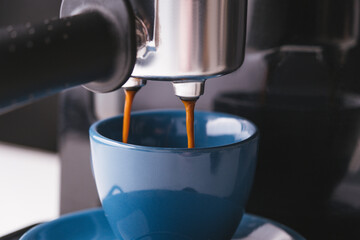 pouring coffee into a cup