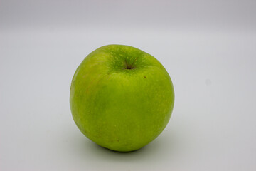 One green apple on white background
