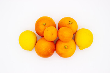 Few oranges, tangerines and lemons on white background.