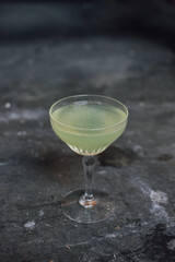 green Last Word cocktail made with Gin, Green Chartreuse, lime juice, Maraschino liqueur. Served in crystal glass