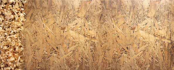Wood shavings on table background. Wooden shaving at old plank board