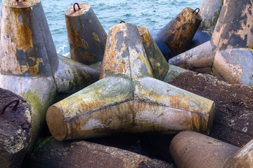 Massive concrete breakwaters to protect the coast from the destructive effects of sea waves.