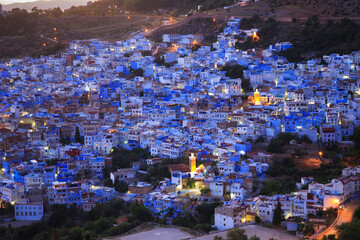 Aerial evening view of Chefchaouen in Morocco. The city is noted for its buildings in shades of...