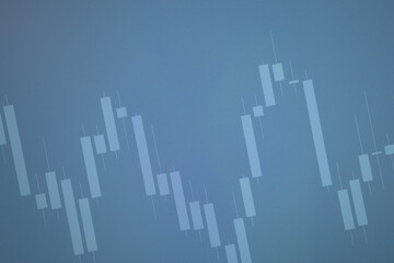 Blue background with a market candle bar chart on the screen. Stock, currency and commodity market concept. Economic background