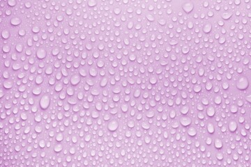 Cosmetic moisturizing liquid drops on purple pink pastel background. Toner or lotion. Hyaluronic serum