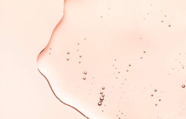 Cream gel orange transparent cosmetic sample texture with bubbles on peach orange background
