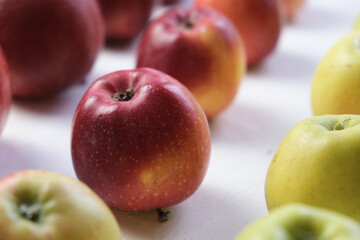 Green and red apples close up. Juicy fruits. Useful snack. Vegetarian food. Delicious, healthy snack. Vitamins, microelements. Fat burning. copy space