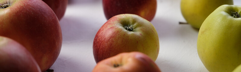 Green and red apples close up. Juicy fruits. Useful snack. Vegetarian food. Delicious, healthy snack. Vitamins, microelements. Fat burning. copy space