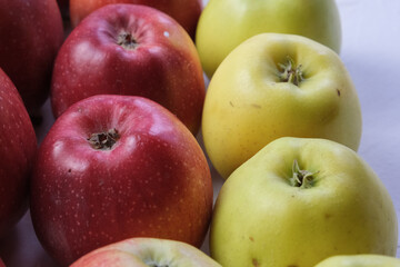 Green and red apples close up. Juicy fruits. Useful snack. Vegetarian food. Delicious, healthy snack. Vitamins, microelements. Fat burning. copy space